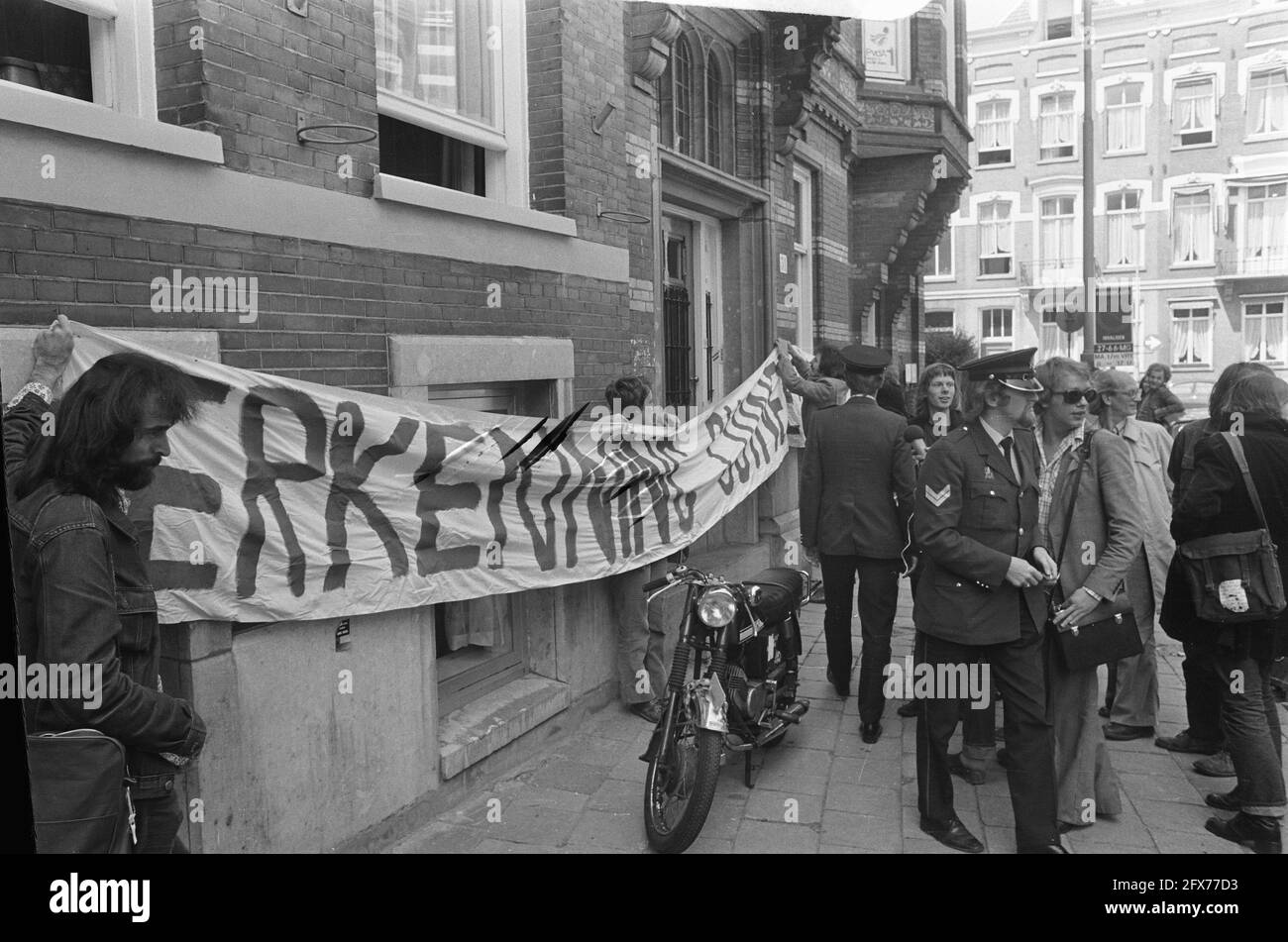 Action group tries to occupy PvdA party office in Amsterdam in connection with recognition of Guinea Bissau, banner on wall of building, 28 May 1974, action groups, occupations, buildings, banners, The Netherlands, 20th century press agency photo, news to remember, documentary, historic photography 1945-1990, visual stories, human history of the Twentieth Century, capturing moments in time Stock Photo