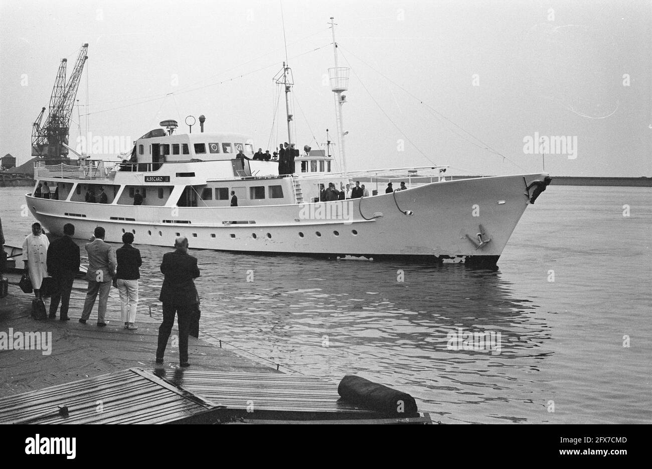 Prince Rainier's yacht on fire due to explosion in engine room. The yacht enters the port of Delfzijl with tugboat assistance, 14 August 1963, YACHT, ports, The Netherlands, 20th century press agency photo, news to remember, documentary, historic photography 1945-1990, visual stories, human history of the Twentieth Century, capturing moments in time Stock Photo