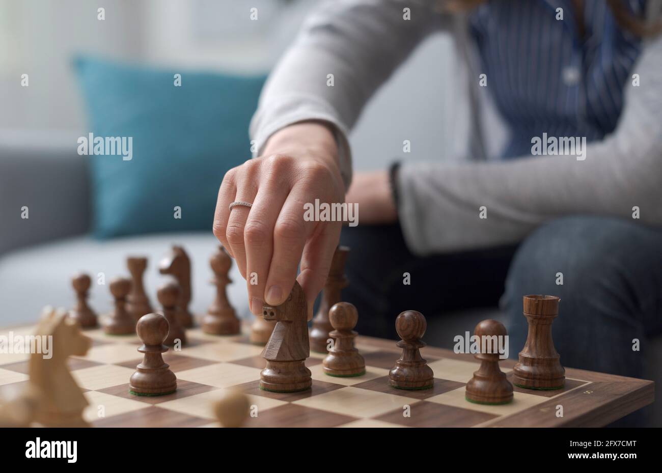 Woman moving chess piece hi-res stock photography and images - Alamy