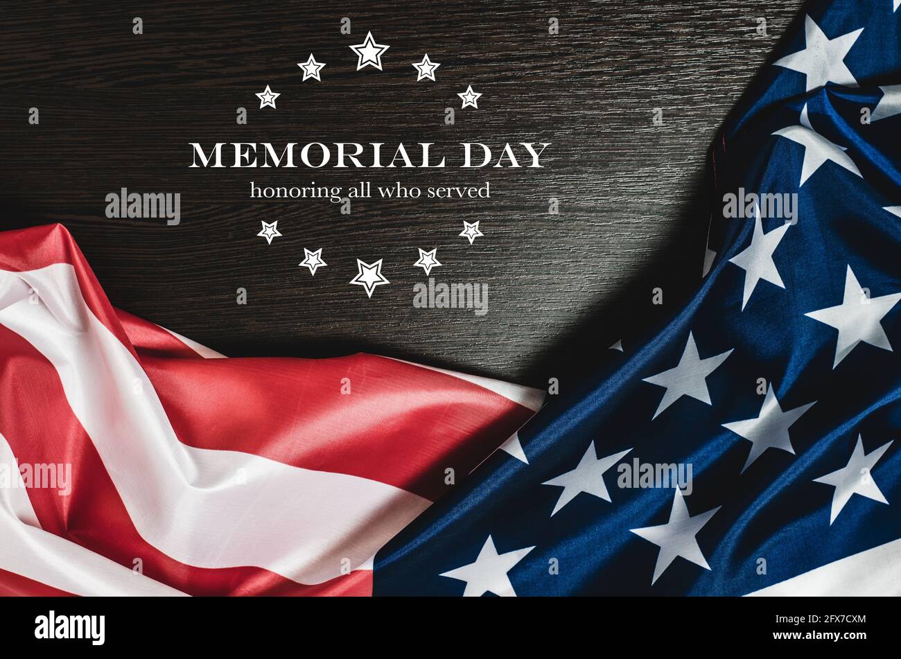 American flag on a dark wooden background with the text MEMORIAL DAY ...