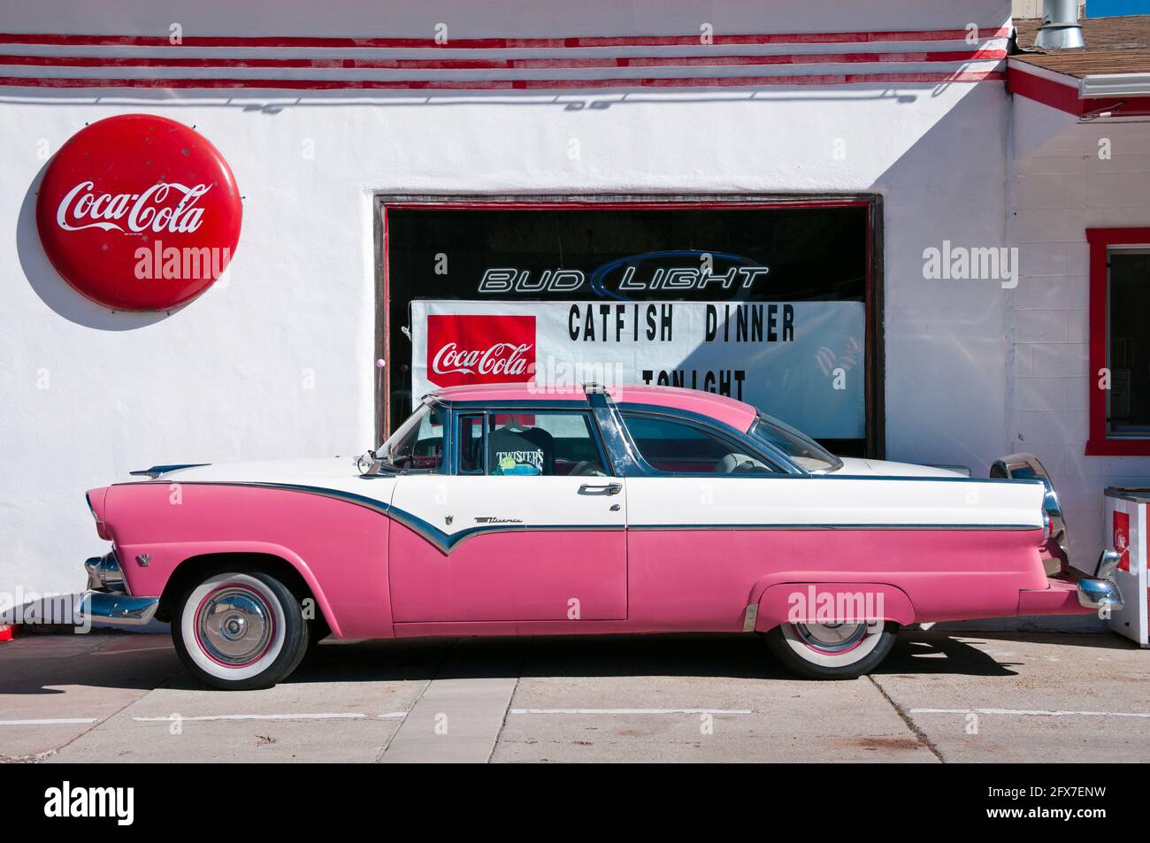 Classic pink Ford Fairlane Crown Victoria car (1950s) parked outside an American dinner along historic Route 66, Williams, Arizona, USA Stock Photo
