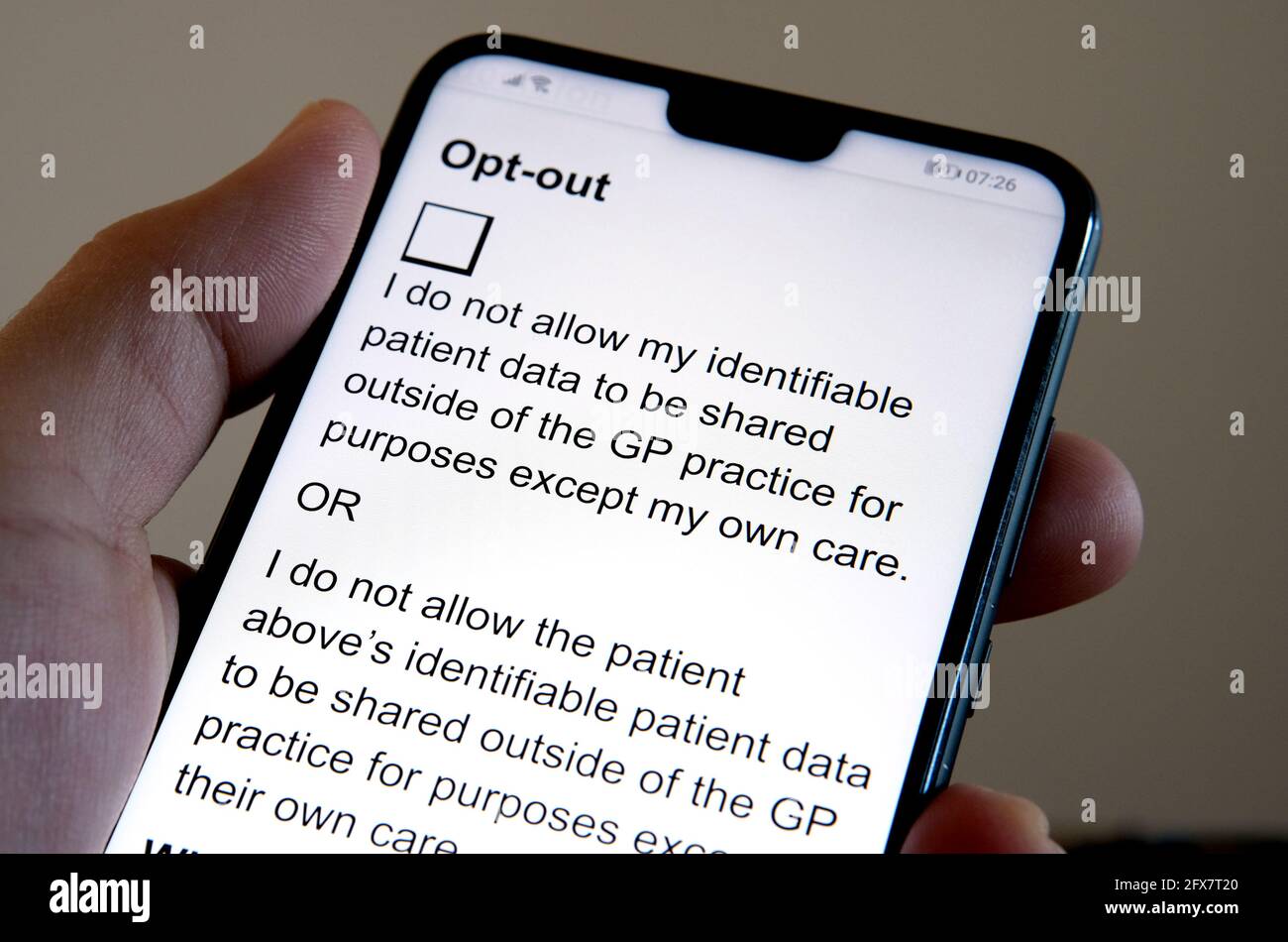 Consent withdrawal form at NHS Digital website seen on the smartphone. Form that stops NHS patient records to be shared with third parties. Stock Photo