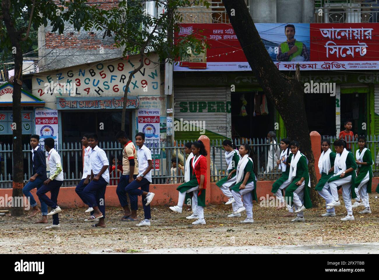 Bangladeshi school children marching in their school's courtyard. Dhaka, Bangladesh. Stock Photo