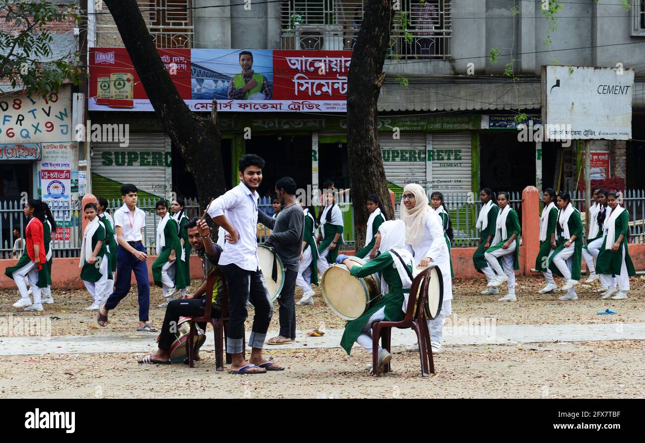 Bangladeshi school children marching in their school's courtyard. Dhaka, Bangladesh. Stock Photo