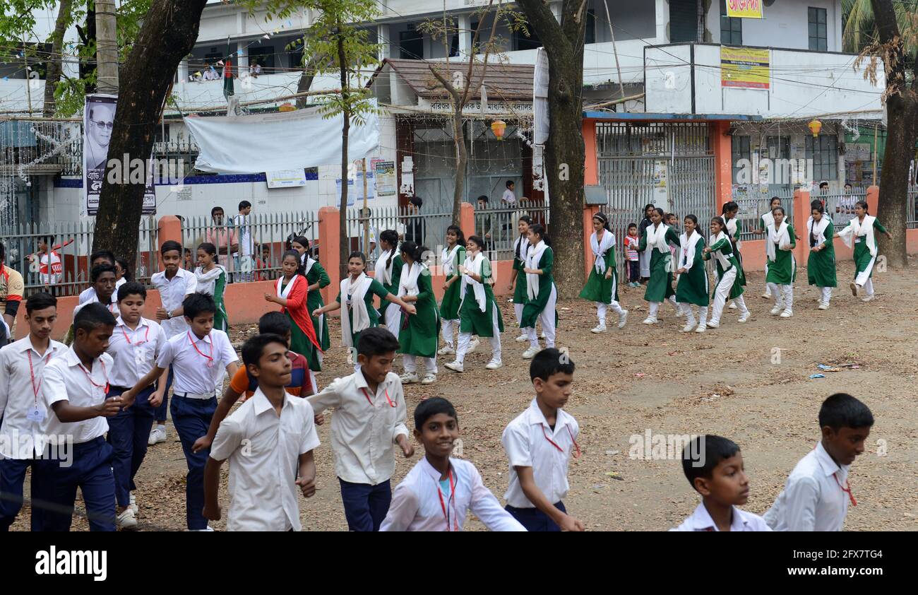 Bangladeshi school children marching in their school's courtyard. Dhaka, Bangladesh. Stock Photo