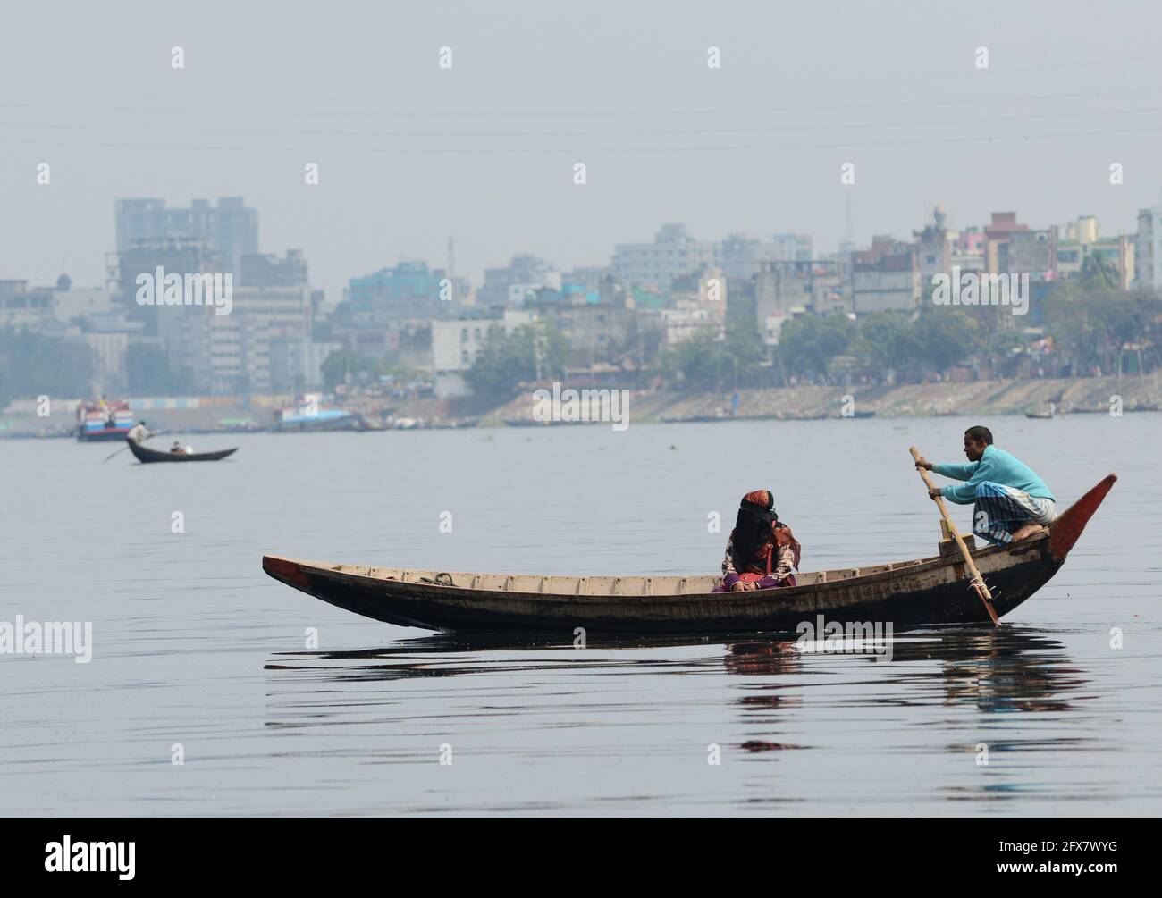 Boat taxis crossing the Buriganga river in Dhaka, Bangladesh. Stock Photo
