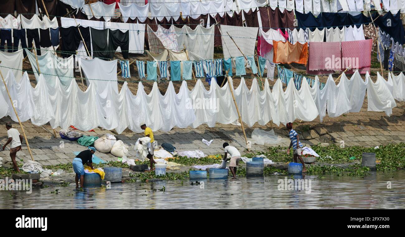 Laundry washing and drying on the Dhobi Ghat on the bank of the Buriganga river in Dhaka, Bangladesh. Stock Photo
