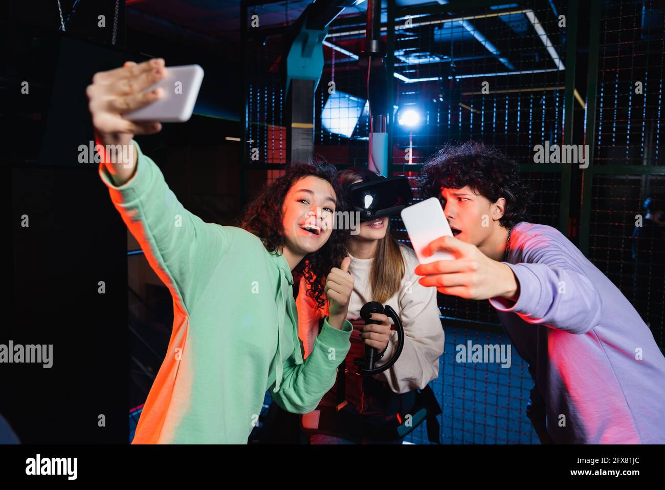 cheerful interracial teenagers taking selfie with friend in vr headset  Stock Photo - Alamy