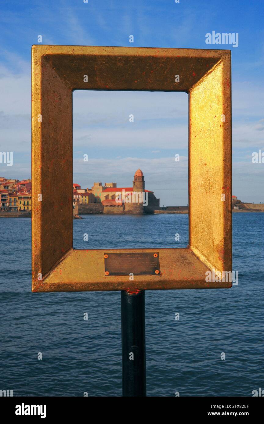 A former pharos lighthouse framed in gold: the view through one of 12  'Points 2 vue' empty frame sculptures installed by French visual artist  Marc-André de Figueres around Collioure in Pyrénées-Orientales, Occitanie,