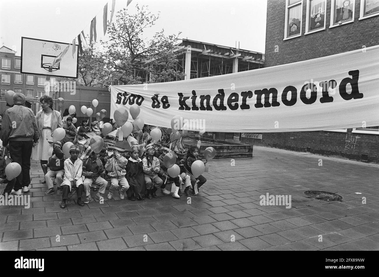Batjan school in Amsterdam receives climbing frame sailing ship; banner Stop the child murder, 22 May 1985, The Netherlands, 20th century press agency photo, news to remember, documentary, historic photography 1945-1990, visual stories, human history of the Twentieth Century, capturing moments in time Stock Photo