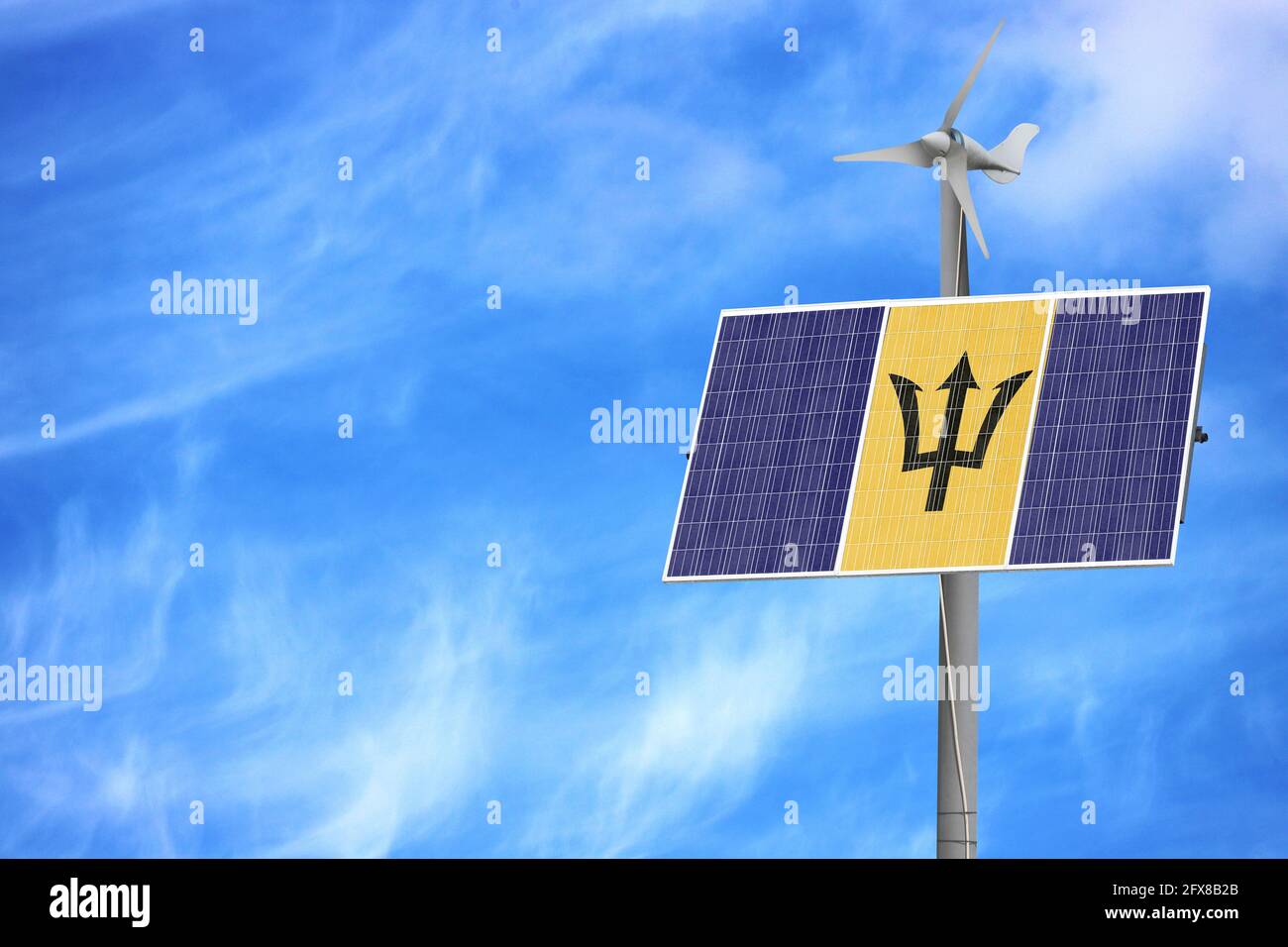 Solar panels against a blue sky with a picture of the flag of Barbados