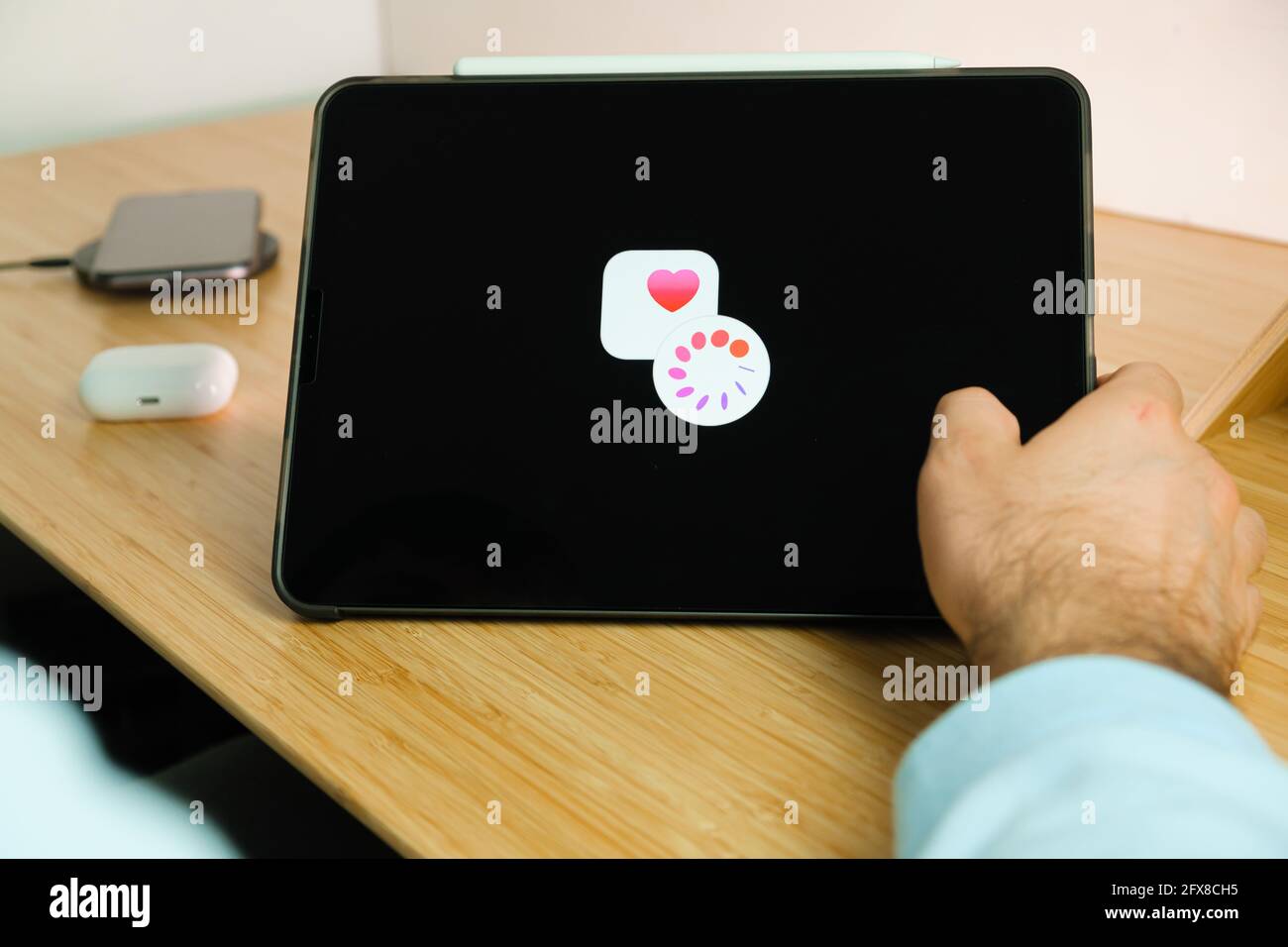 Apple Cycle Tracking logo on the screen of iPad tablet. March 2021, San Francisco, USA Stock Photo