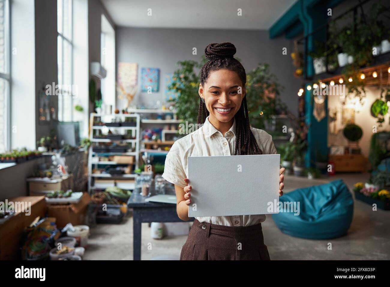 Artist showing her painting tool in front of the camera Stock Photo