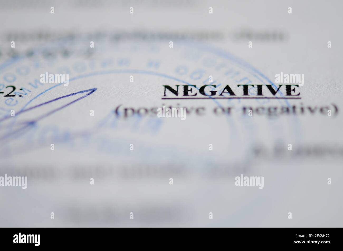 New york, USA - May 26, 2021: Negative covid test paper document  macro close up view Stock Photo