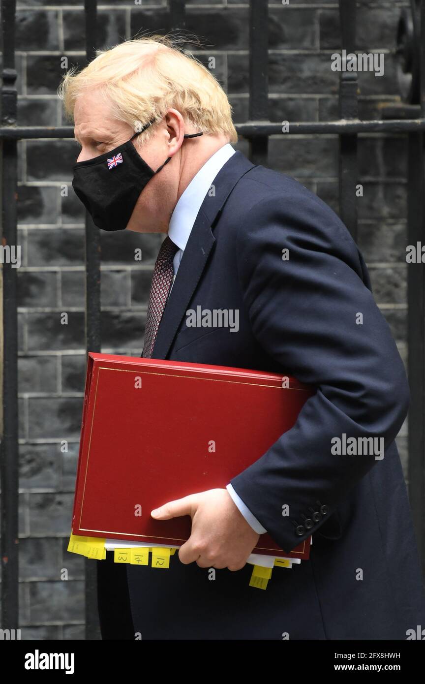 Prime Minister Boris Johnson leaves 10 Downing Street to attend Prime Minister's Questions at the Houses of Parliament, London. Picture date: Wednesday May 26, 2021. Stock Photo