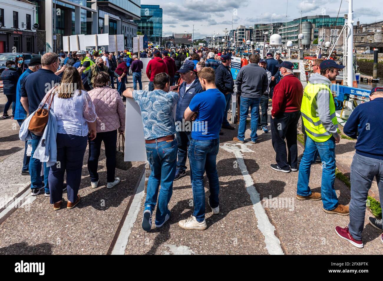 Cork, Ireland. 26th May, 2021. Between 50-60 trawlers gathered at Roches Point this morning before sailing up the River to Cork City to blockade the port. Fishermen are angry at their 15% quota and the new rules for weighing their catch. Hundreds of fishermen and their supporters were at the rally on Kennedy Quay. Credit: AG News/Alamy Live News Stock Photo
