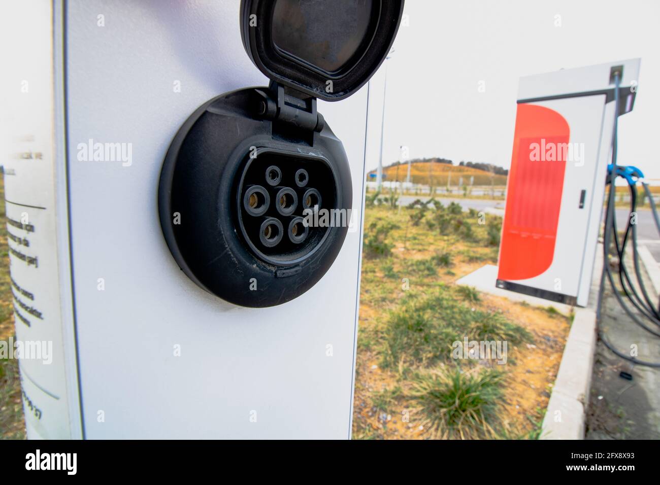 DC power supply of the EV charger station in focus. Electric vehicle