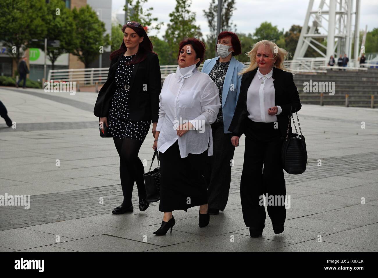 Jenny Hicks (front right) and Christine Burke (front left), relatives of victims of the Hilsborough leave the Lowry Theatre, Salford Quays, Greater Manchester, after a judge ruled there was no case to answer in the trial of two retired police officers, Alan Foster and Donald Denton, and retired solicitor Peter Metcalf, who were all accused of perverting the course of justice following the Hillsborough disaster on April 15, 1989. Picture date: Wednesday May 26, 2021. Stock Photo