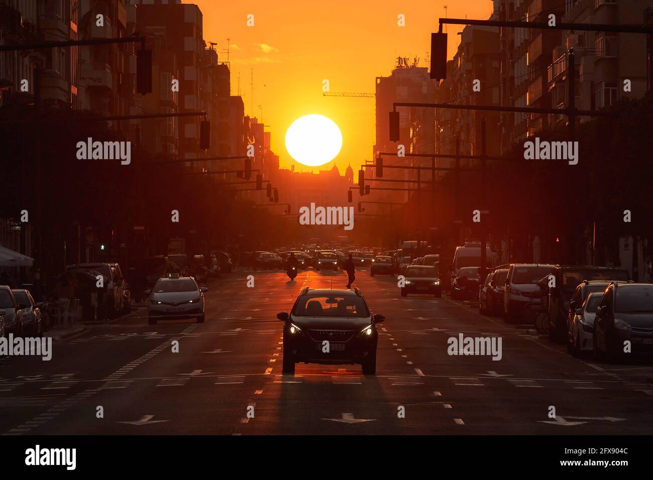 Sunset in a large avenue of Valencia (Spain) Stock Photo