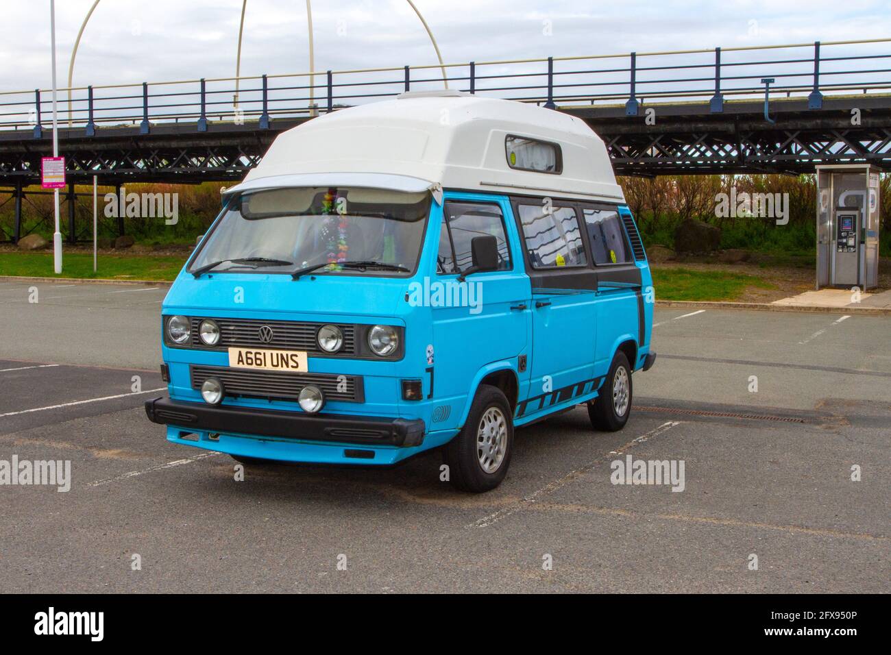 1984 80s blue white VW Volkswagen 1600cc : Caravans and Motorhomes, campervans on Britain's roads, RV leisure vehicle, family holidays, caravanette vacations, Touring caravan holiday, van conversions, Vanagon autohome, life on the road UK Stock Photo