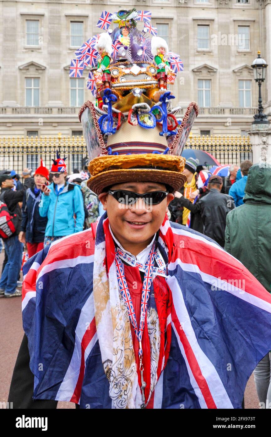 Superfan outside Buckingham Palace at the Queens Diamond Jubilee celebration in London, UK, wearing Union Jack flag and elaborate hat Stock Photo