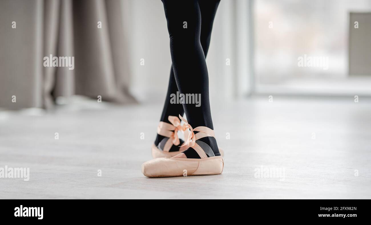 Ballerina legs in pointe shoes Stock Photo