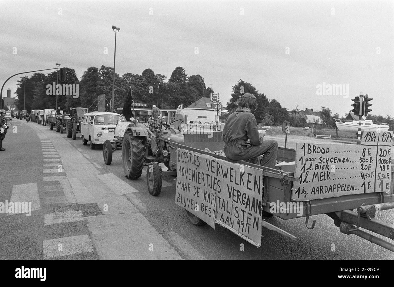 Farmers demonstrate in Belgium; farmers with slogans on car during  demonstration, farmer boys hand out potatoes to policeman, 2 September  1974, AARDAPPEL, FARMERS, demonstrations, The Netherlands, 20th century  press agency photo, news
