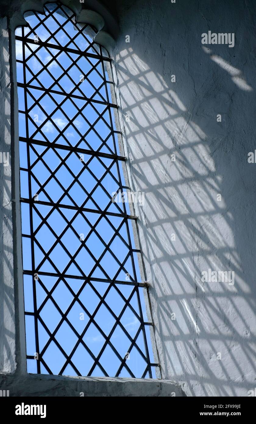 sunshine shining through generic style church window, norfolk, england Stock Photo