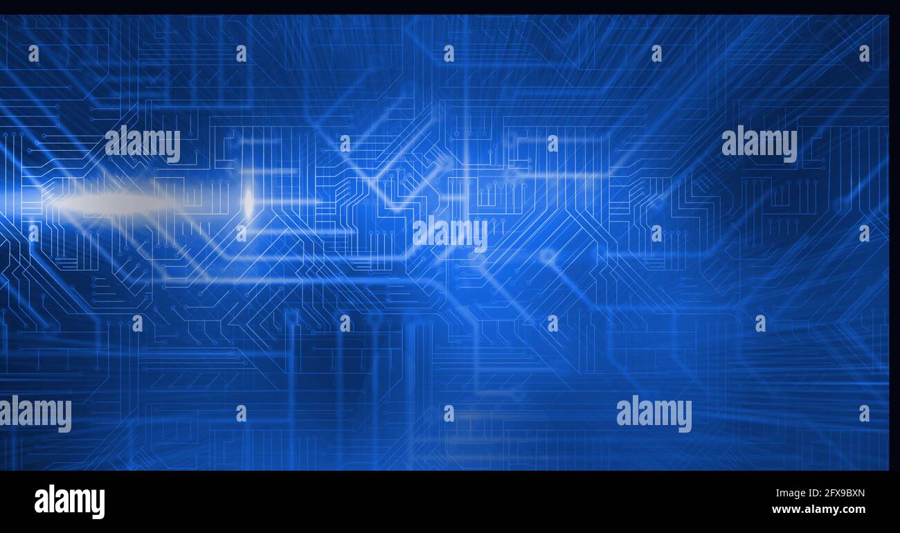 Composition of glowing blue light beams and motherboard over dark background Stock Photo