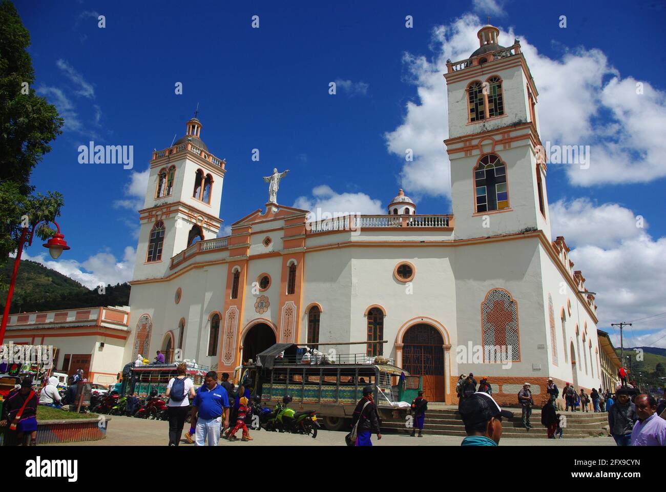 Villagers in traditional dress for market day in front of church in main square,Silvia, Colombia, South America Stock Photo