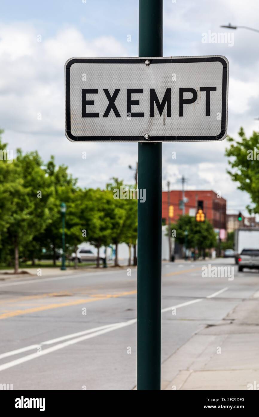 CHATTANOOGA, TN, USA-10 MAY 2021: A black and white 'exempt' sign indicating railroad track crossing the road is out of service. Stock Photo