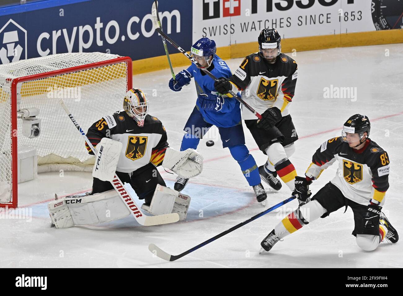 Riga, Latvia. 26th May, 2021. L-R Goalkeeper Mathias Niederberger (GER), Curtis Valk (KAZ) and Marco Nowak and Marcel Brandt (both GER) in action during the 2021 IIHF Ice Hockey World Championship, Group B match Kazakhstan vs Germany, played in Riga, Latvia, on May 26, 2021. Credit: Vit Simanek/CTK Photo/Alamy Live News Stock Photo