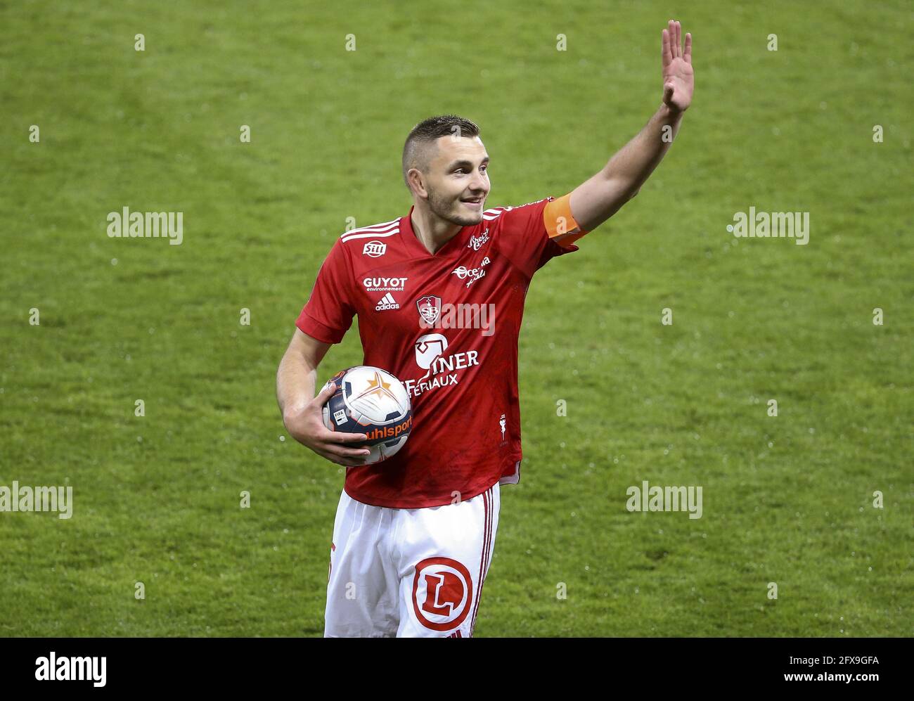 Brendan Chardonnet of Brest celebrates staying in Ligue 1 following the  French championship Ligue 1 football match between Stade Brestois 29 and  Paris Saint-Germain (PSG) on May 23, 2021 at Stade Francis