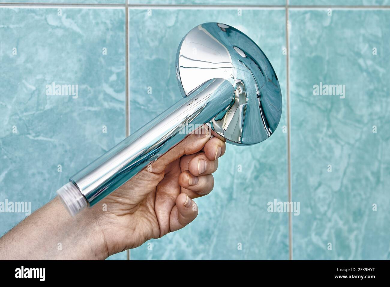 New flat shower head with flow control to replace old clogged one Stock