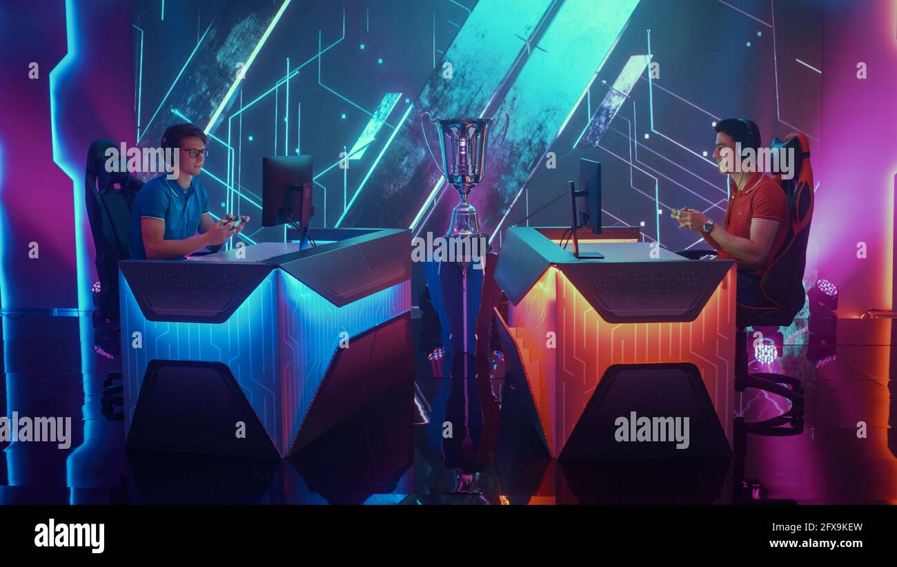 Two Professional Esport Gamers Using Controllers Playing Console Video