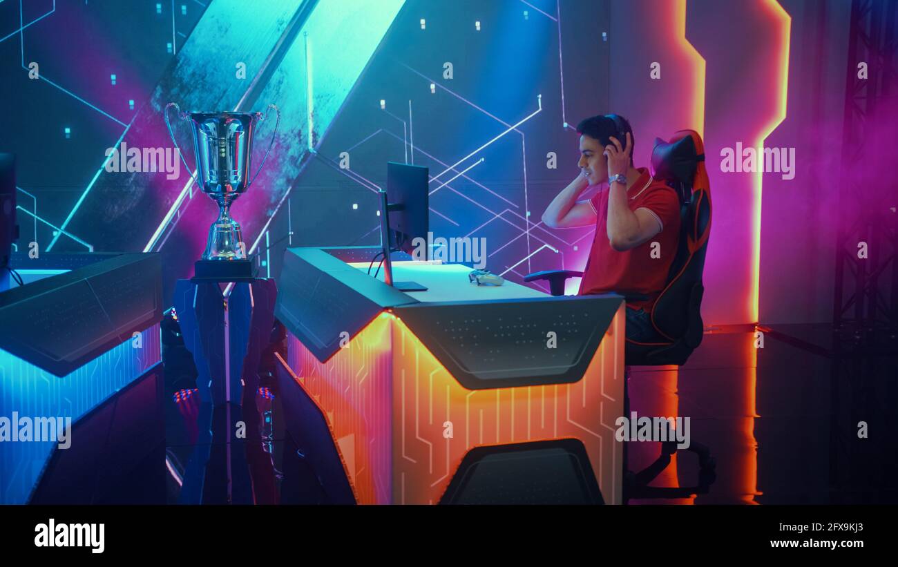 Two Professional eSports Gamers take places at Gaming Stations, Putting