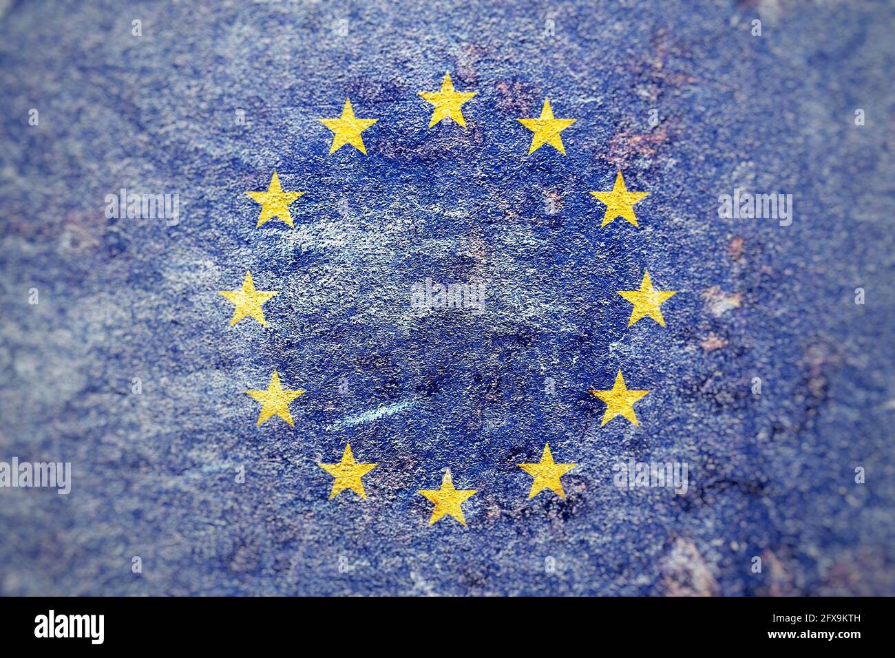 Closeup shot of the faded EU flag painted on an old wall surface Stock Photo