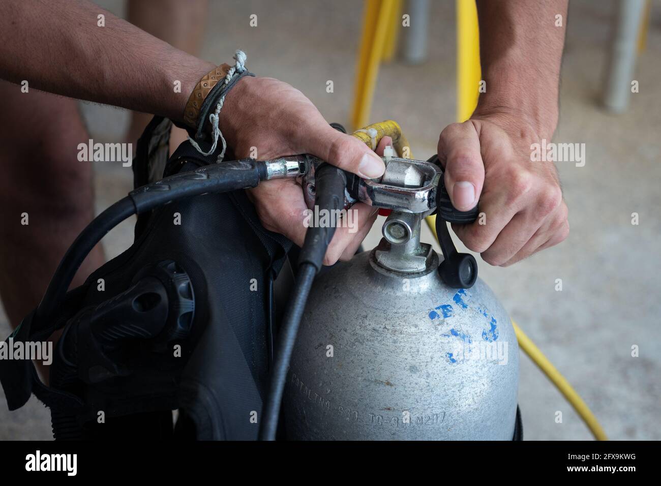 Scuba diver check on the tank before dive Stock Photo