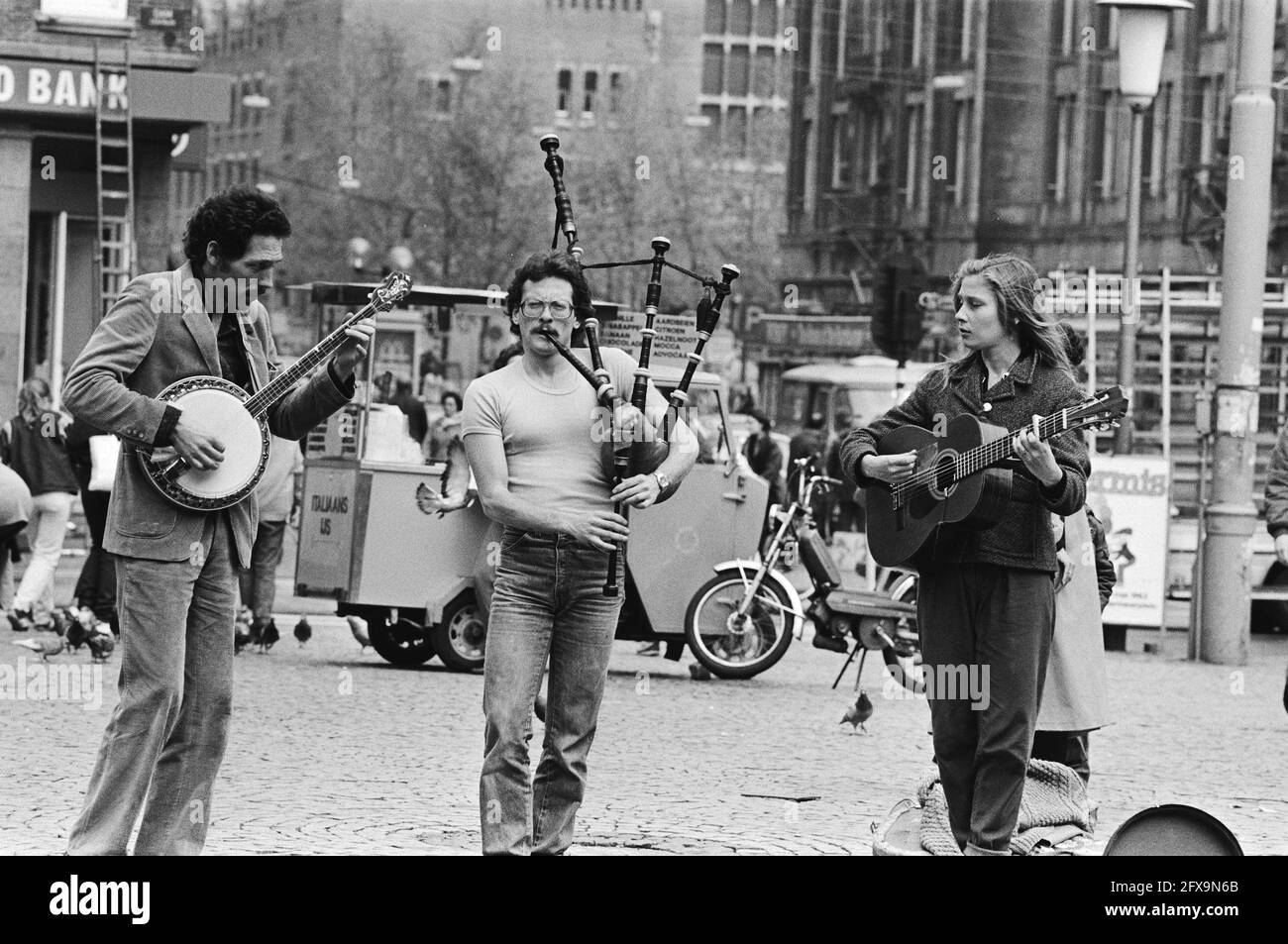 Foreign street musicians with bagpipes and guitar in Amsterdam, May 19, 1983, public holidays, musical instruments, street performers, street scenes, The Netherlands, 20th century press agency photo, news to remember, documentary, historic photography 1945-1990, visual stories, human history of the Twentieth Century, capturing moments in time Stock Photo