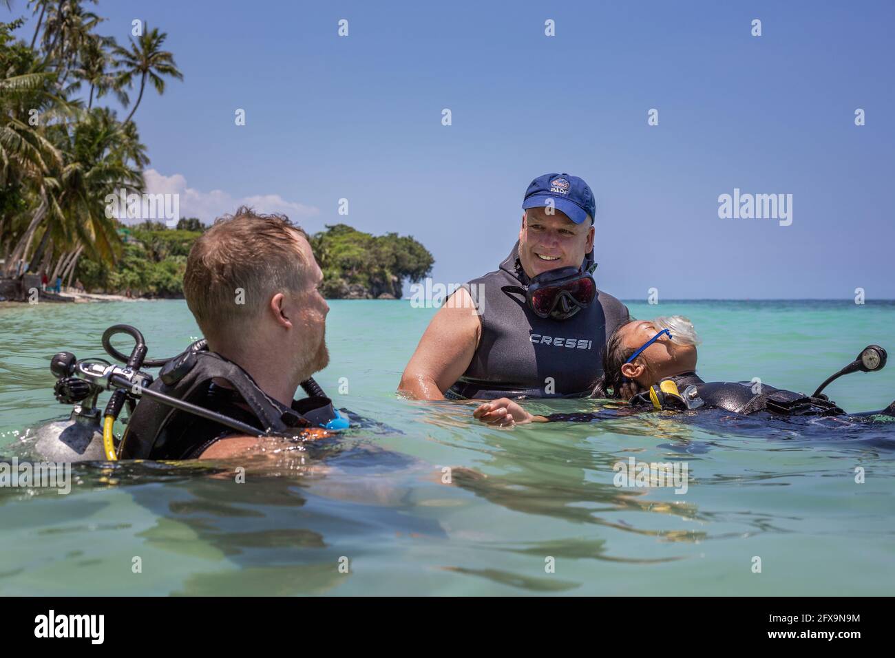 Panglao, Philippines - April 29, 2021: Scuba diver, instructor in confined water teaching, studying, evaluating skills, rescue skills Stock Photo