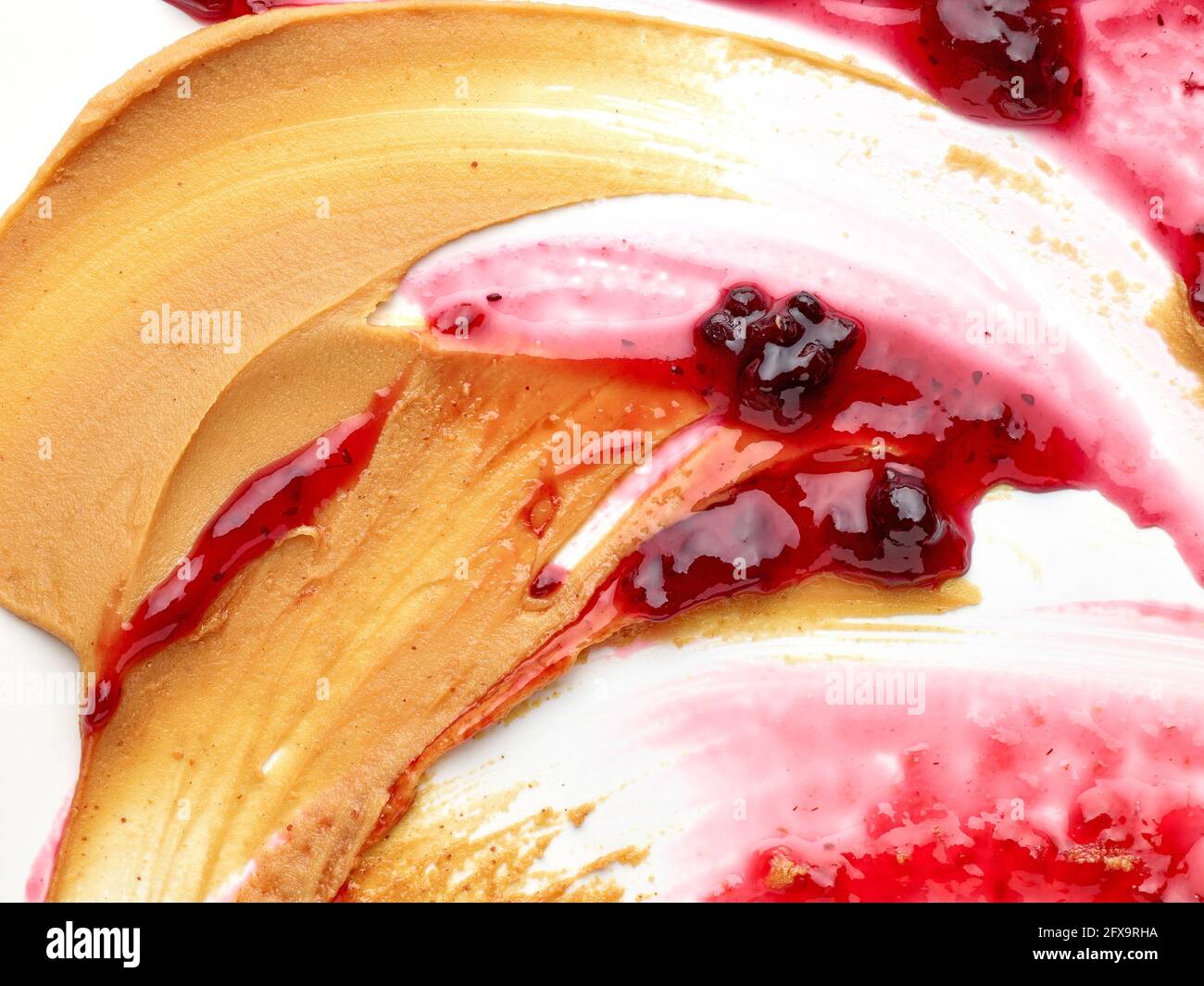 mixed peanut butter and jam macro top view Stock Photo Alamy
