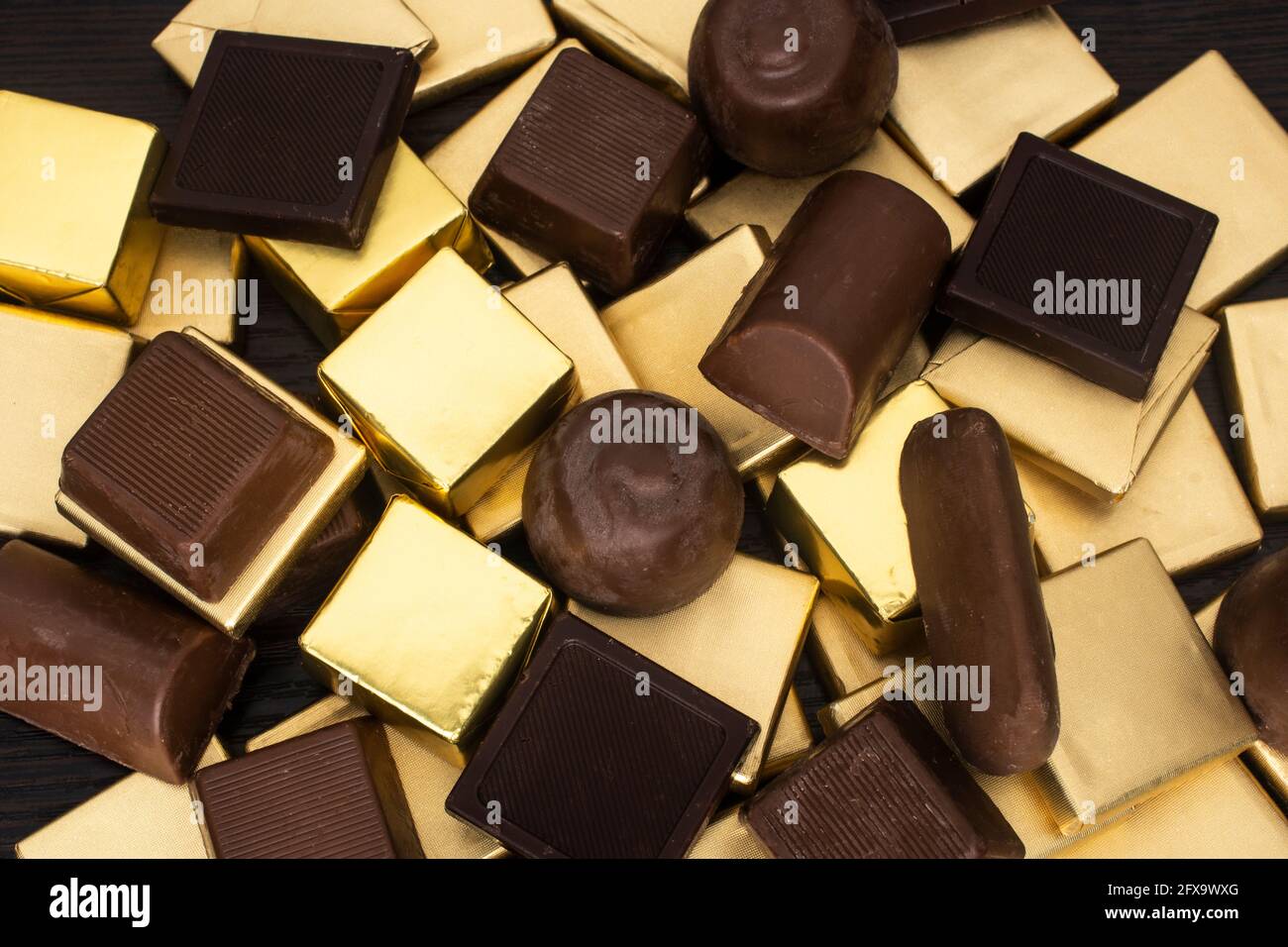 chocolates in gold foil Stock Photo Alamy