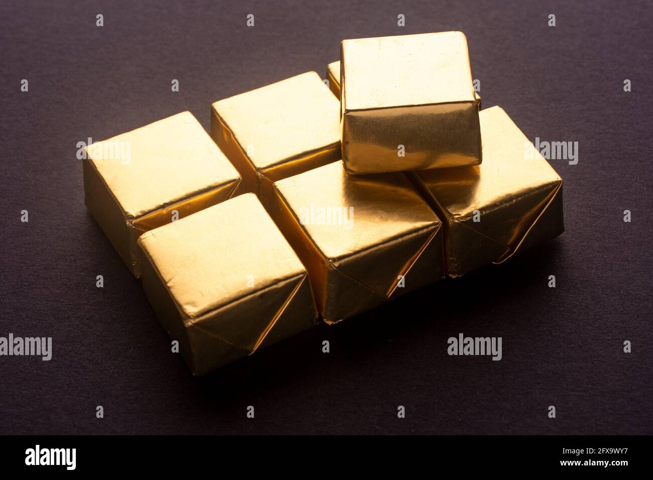 chocolates in gold foil Stock Photo Alamy