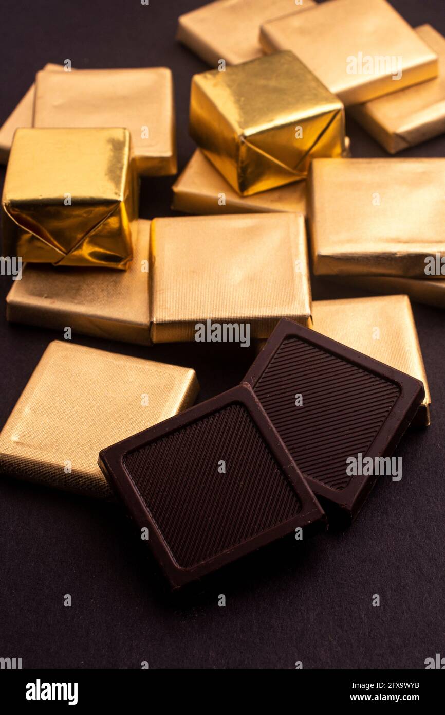 chocolates in gold foil Stock Photo Alamy