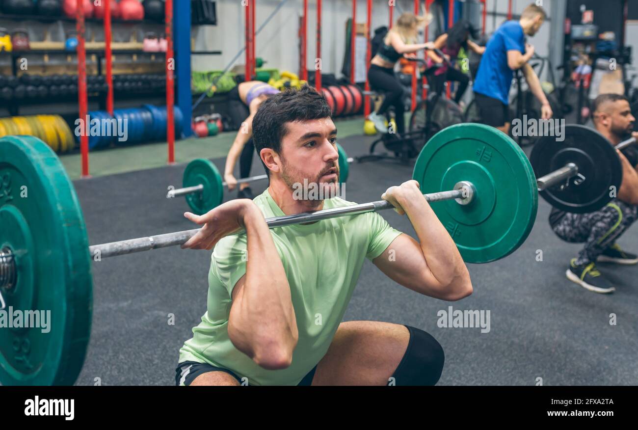 Weightlifting man over head hi-res stock photography and images - Alamy