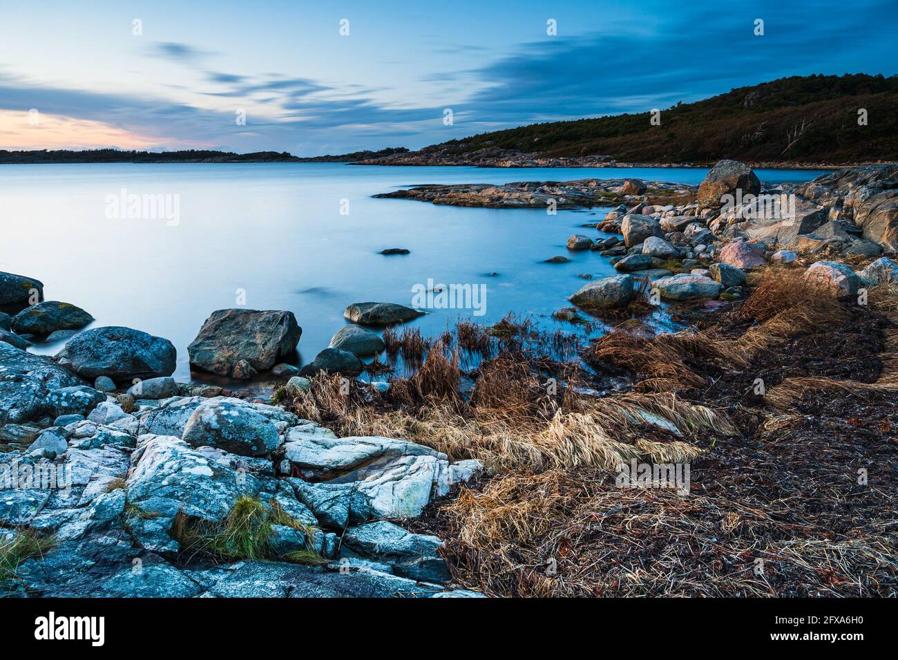 Coastal scenery in evening light Stock Photo