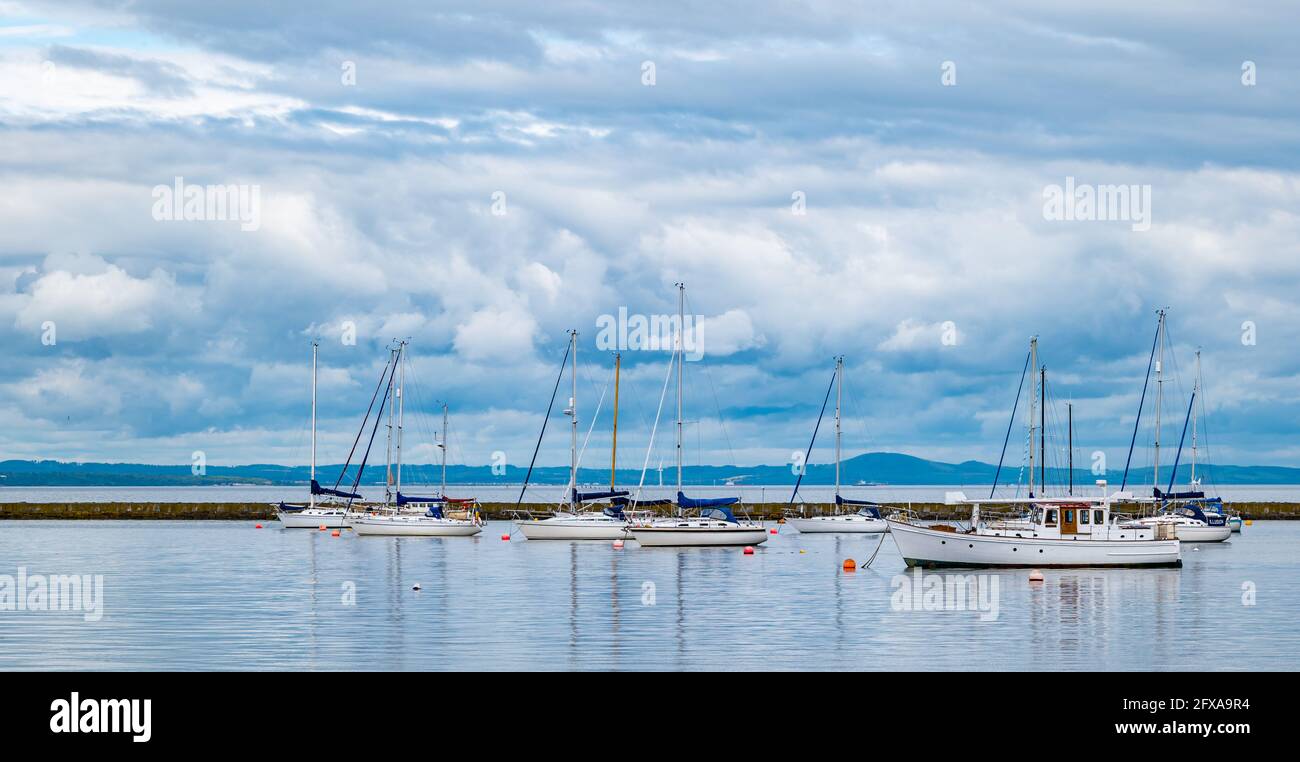 Edinburgh, Scotland, United Kingdom, 26th May 2021. Sailing boats moored in Granton harbour Stock Photo