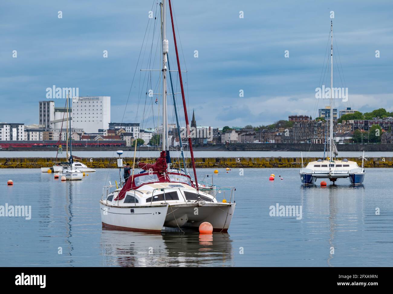 Edinburgh, Scotland, United Kingdom, 26th May 2021. Catamaran sailing boats moored in Granton harbour Stock Photo
