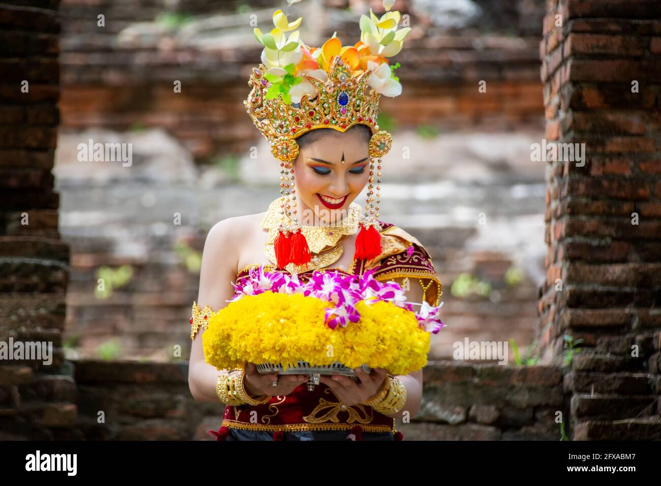 Asian travel background. Beautiful Balinese dancer woman in traditional