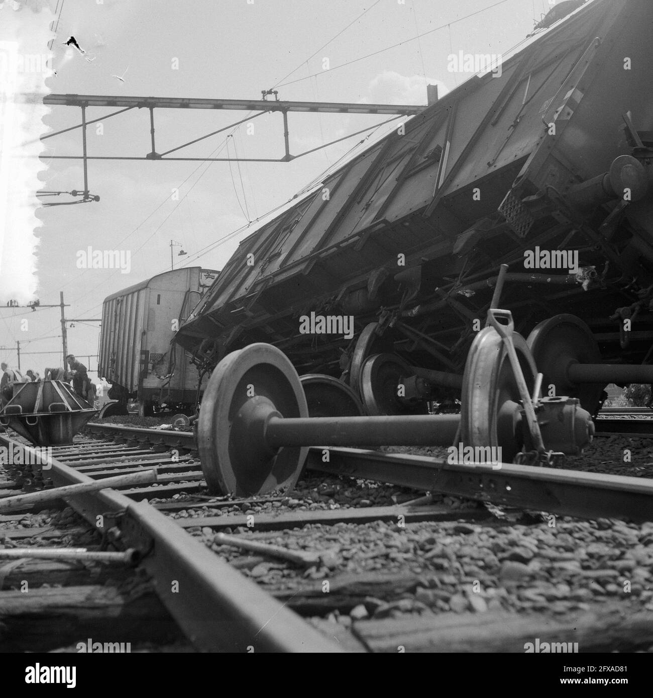 As a diesel passenger train from Utrecht C.S. drove through a red signal light, it collided with a freight train from Geldermalsen. The passenger train hit the freight train exactly on a switch in the side. Four goods wagons toppled over, a fifth derailed. The havoc was great but everyone was unharmed, 14 August 1964, accidents, railroads, trains, The Netherlands, 20th century press agency photo, news to remember, documentary, historic photography 1945-1990, visual stories, human history of the Twentieth Century, capturing moments in time Stock Photo